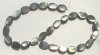 16 inch strand of 15x10mm Flat Oval Black Mother of Pearl Shells